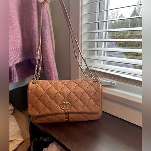 Channel sheepskin flap shoulder bag